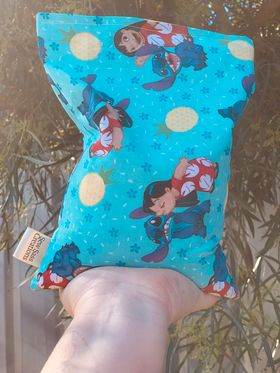Colorful fabric pouch featuring a Lilo and Stitch design, ideal for Sew In Seam Tags Labels for Scrunchies Wristlets Blankets Crafts